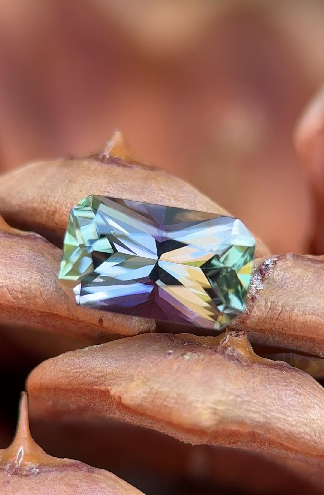 Video showing the 3.01ct Tanzanite gemstone turning to reveal radiant-cut facets and shifting mermaid colors
