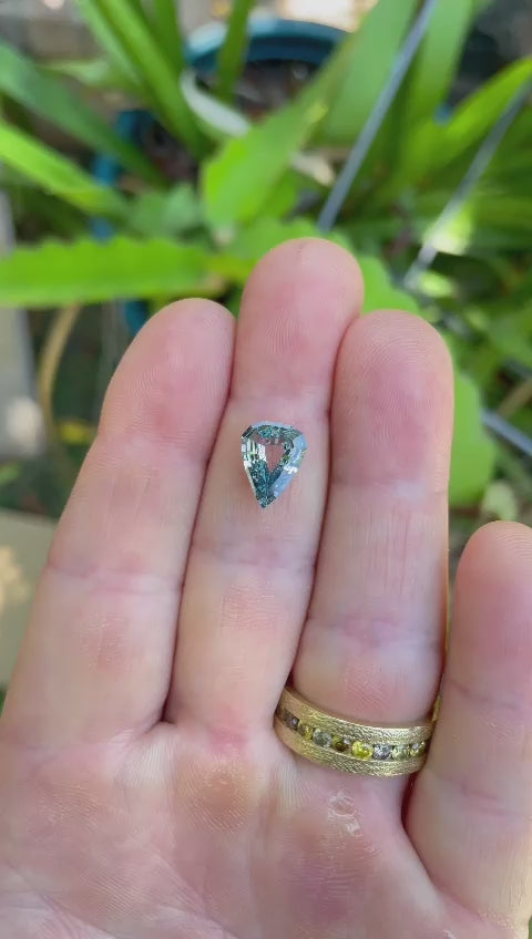 Close-up video of Color Change Sapphire, Gray to Violet, Modified Geometric Step Cut Portrait Pear, 2.51 Carats, 10.13 x 8.82 x 3.17 mm, Sourced from Sri Lanka, No Treatment, $3825.00 Price