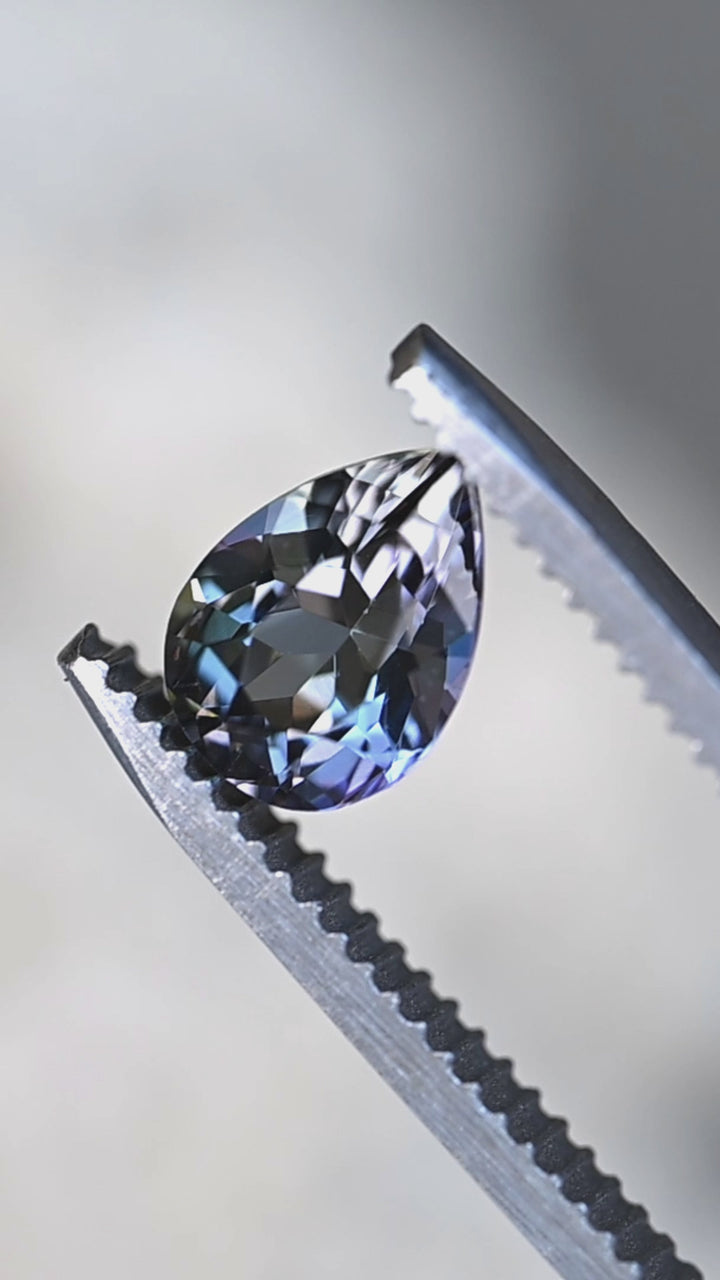 Watch this untreated 1.55 carat Merelani Hills tanzanite reveal beautiful transitions between teal, blue, green, violet, and golden tones through its precision modified mixed brilliant pear cut.