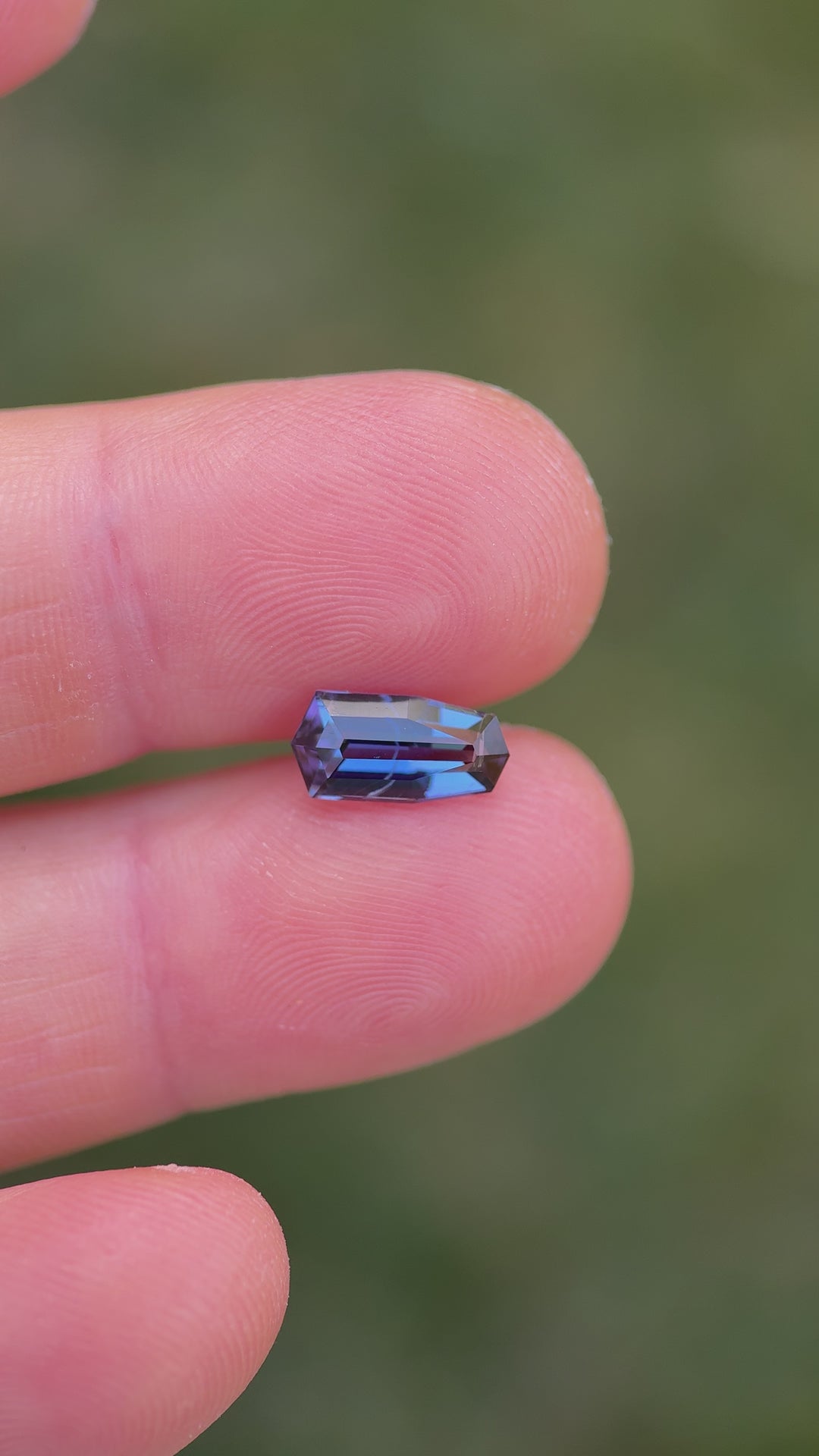Macro video of shield cut tanzanite from Merelani Hills – showcasing faceting and unique geometric symmetry of this 2.13 carat gem.