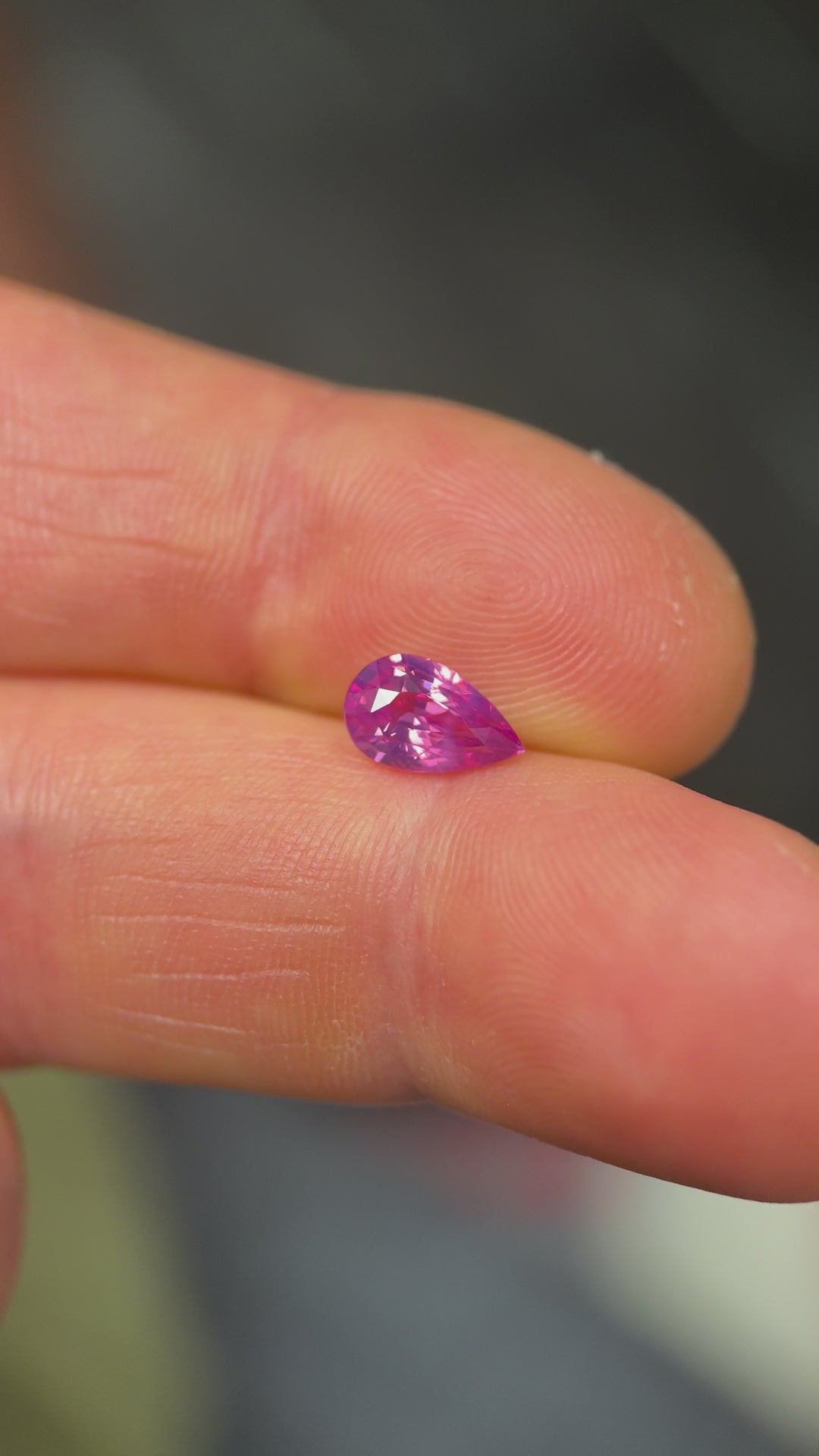Rotating 1.57 carat pink kite sapphire from Sri Lanka under natural light, displaying heated clarity and sparkle.