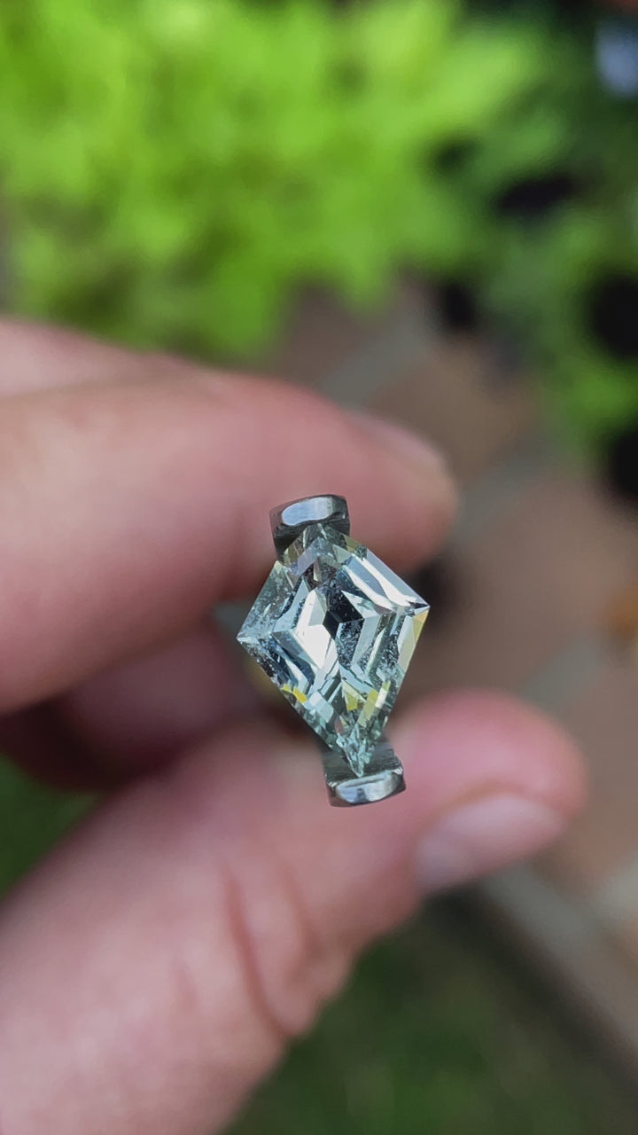 A mesmerizing geometric modified step cut kite sapphire in stunning seafoam green color, weighing 2.28 carats and ethically sourced from Sri Lanka. Showcased for its brilliance and untreated purity.