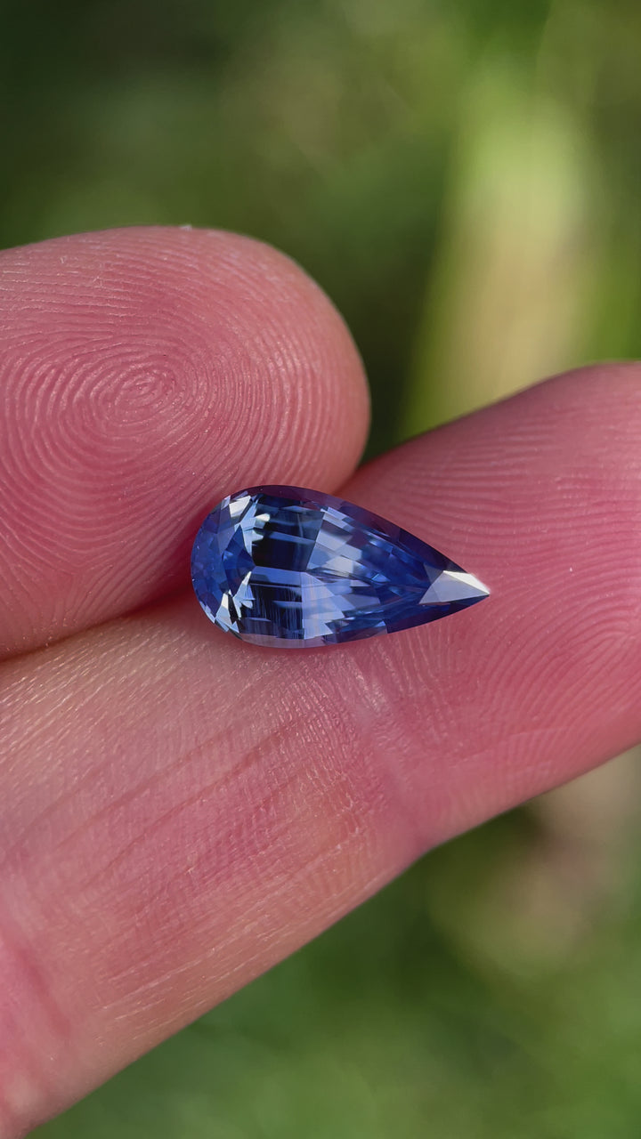 A video capturing the brilliance and vivid color combination of a 3.14-carat pear-shaped parti sapphire, featuring blue and yellow tones. Ethically sourced and untreated from Sri Lanka.
