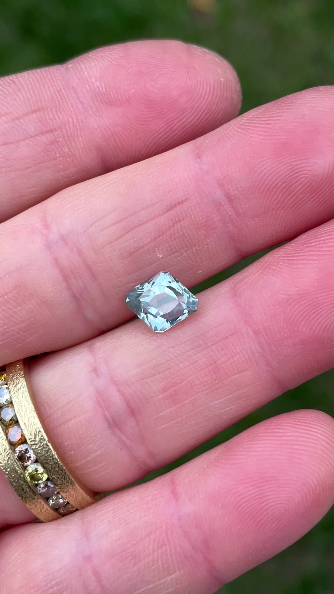 Rotating video of a 2.24 carat unheated Sapphire from Montana, capturing its seafoam teal brilliance and unique rhombus antique faceting.