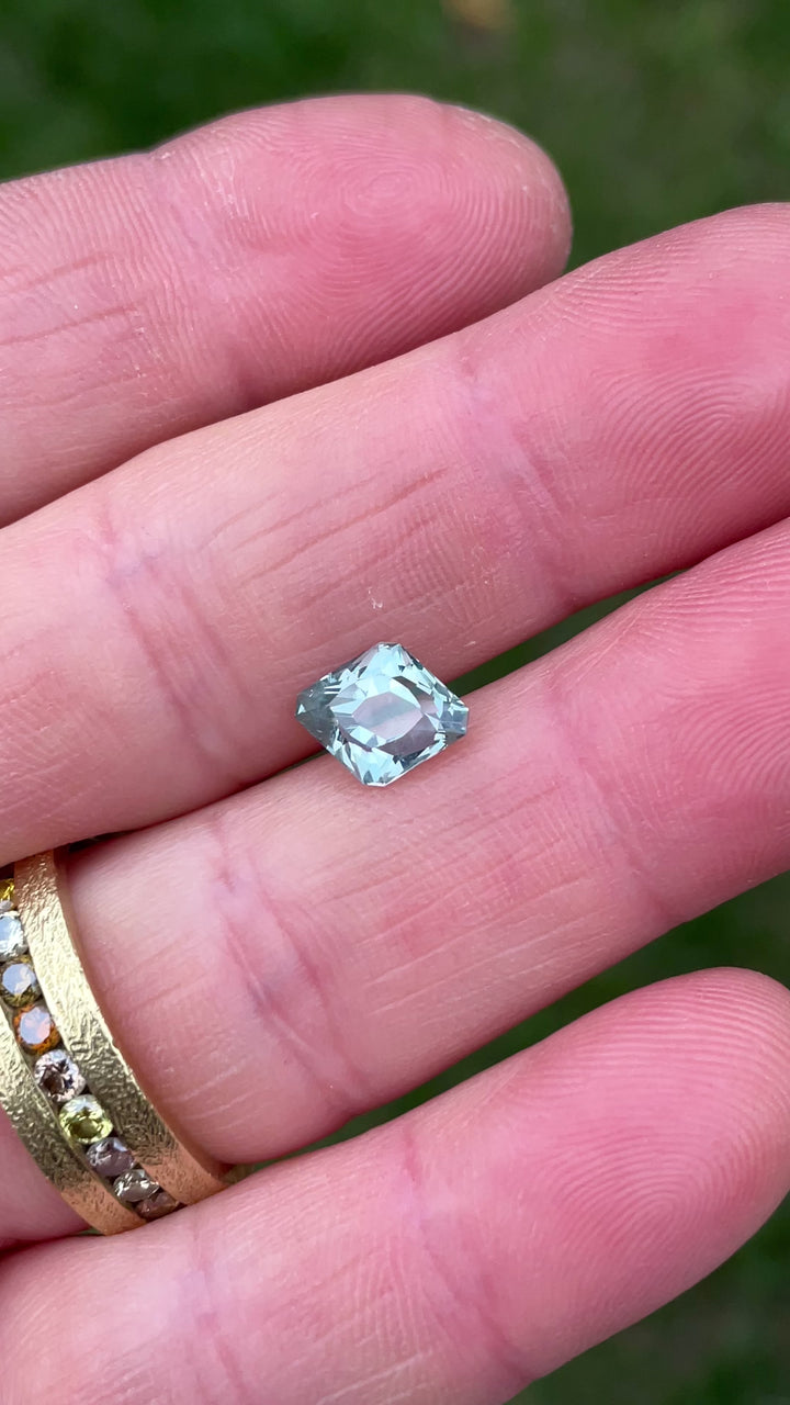 Rotating video of a 2.24 carat unheated Sapphire from Montana, capturing its seafoam teal brilliance and unique rhombus antique faceting.