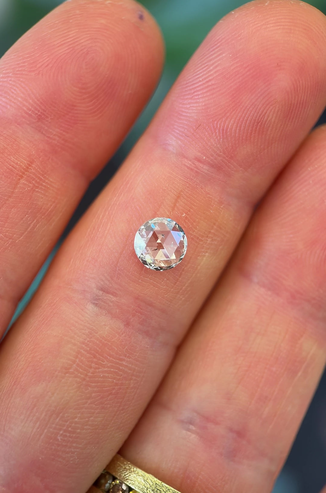 Daylight rotation video of 1.04CT round rose cut diamond, showing its natural sparkle, F color and I1 clarity as it reflects light through vintage-style rose cut facets, ethically sourced from Gahcho Kué Mine, Canada.