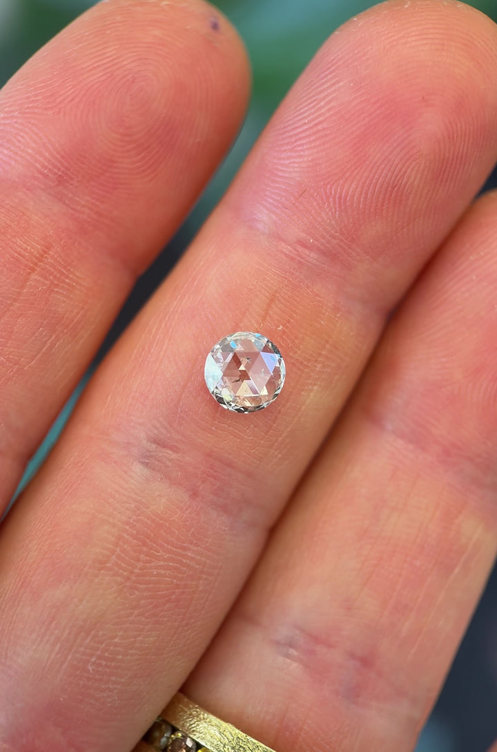 Daylight rotation video of 1.04CT round rose cut diamond, showing its natural sparkle, F color and I1 clarity as it reflects light through vintage-style rose cut facets, ethically sourced from Gahcho Kué Mine, Canada.