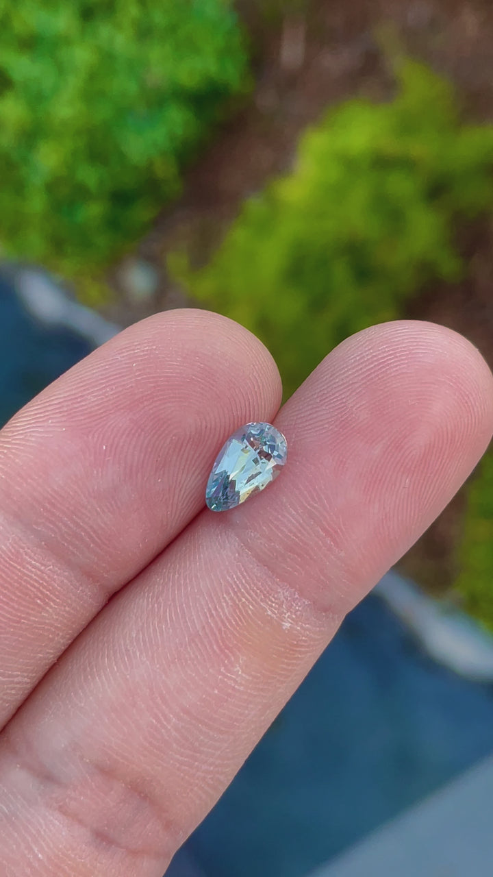 Interactive video featuring a 2.00-carat custom teardrop sapphire, focusing on its unique coloration and flawless cut. The gem from Sri Lanka is examined up close, demonstrating its exceptional quality and size.