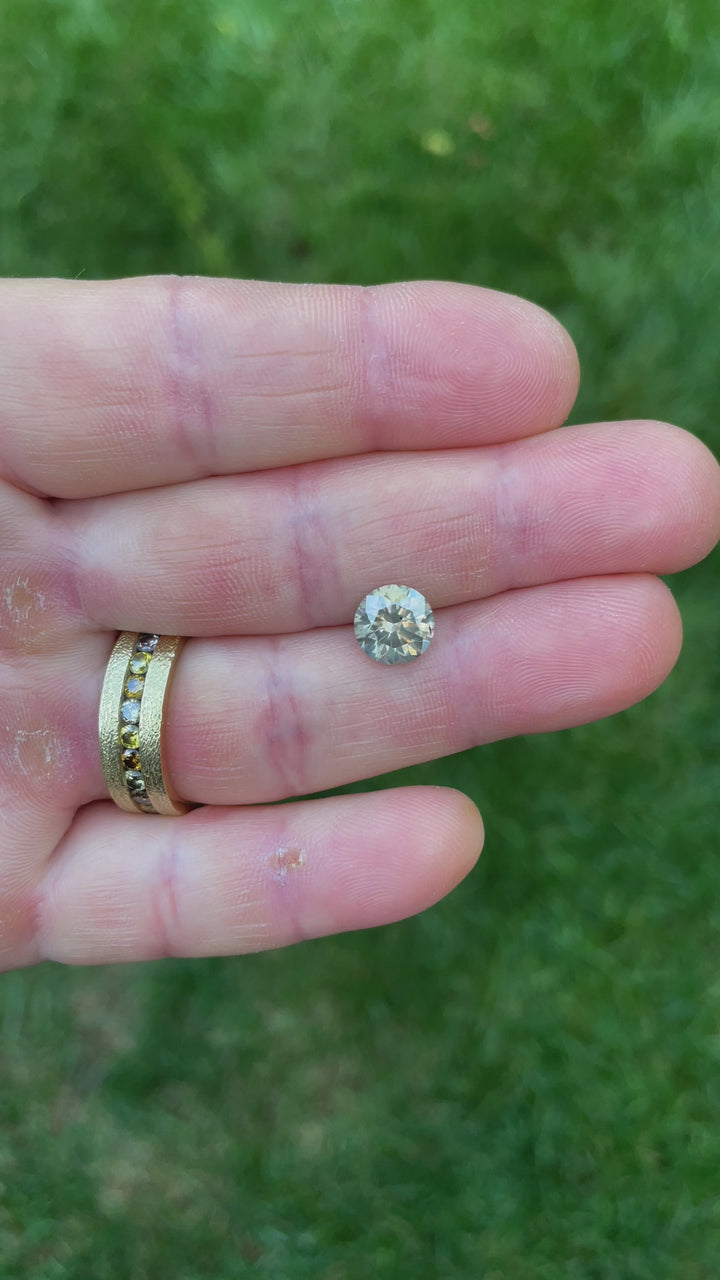 2.53-carat Fancy Gray Diamond in Round Brilliant Cut from South Africa, showcased under natural lighting to highlight its brilliance and clarity.