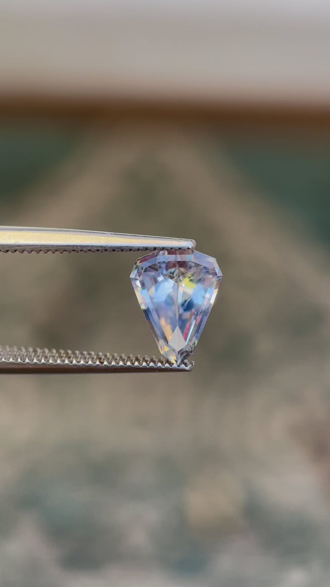 Video showcasing Light Ceylon Gray Blue Sapphire, Custom Shield Cut, 1.98 Carats, 9.92 x 7.81 x 3.96 mm, Originating from Sri Lanka, No Heat Treatment, $1980.00 Price