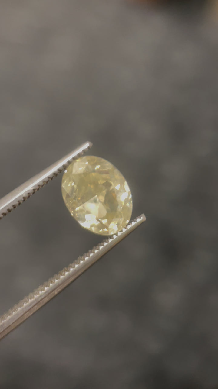 A macro shot of the diamond under natural light, emphasizing the brilliance, facet precision, and play of color in this rare opalescent gemstone.