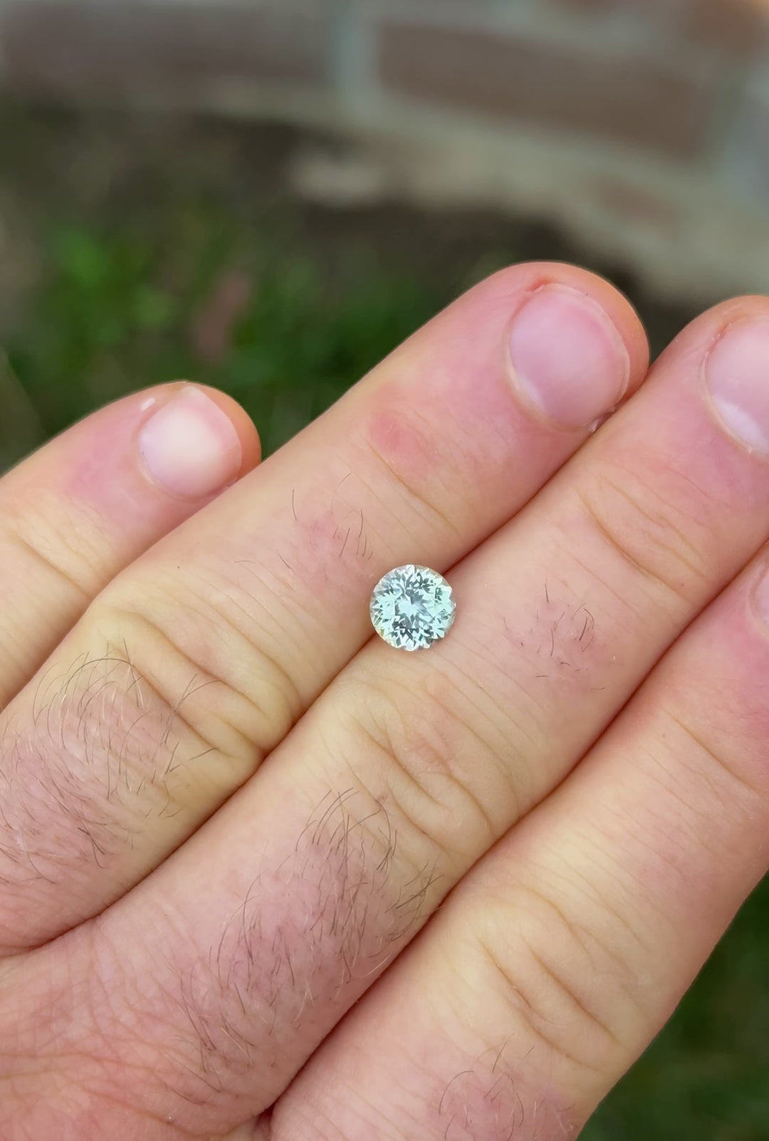 Rotating 1.59 carat mint green Montana sapphire in Portuguese cut showing natural brilliance and sparkle
