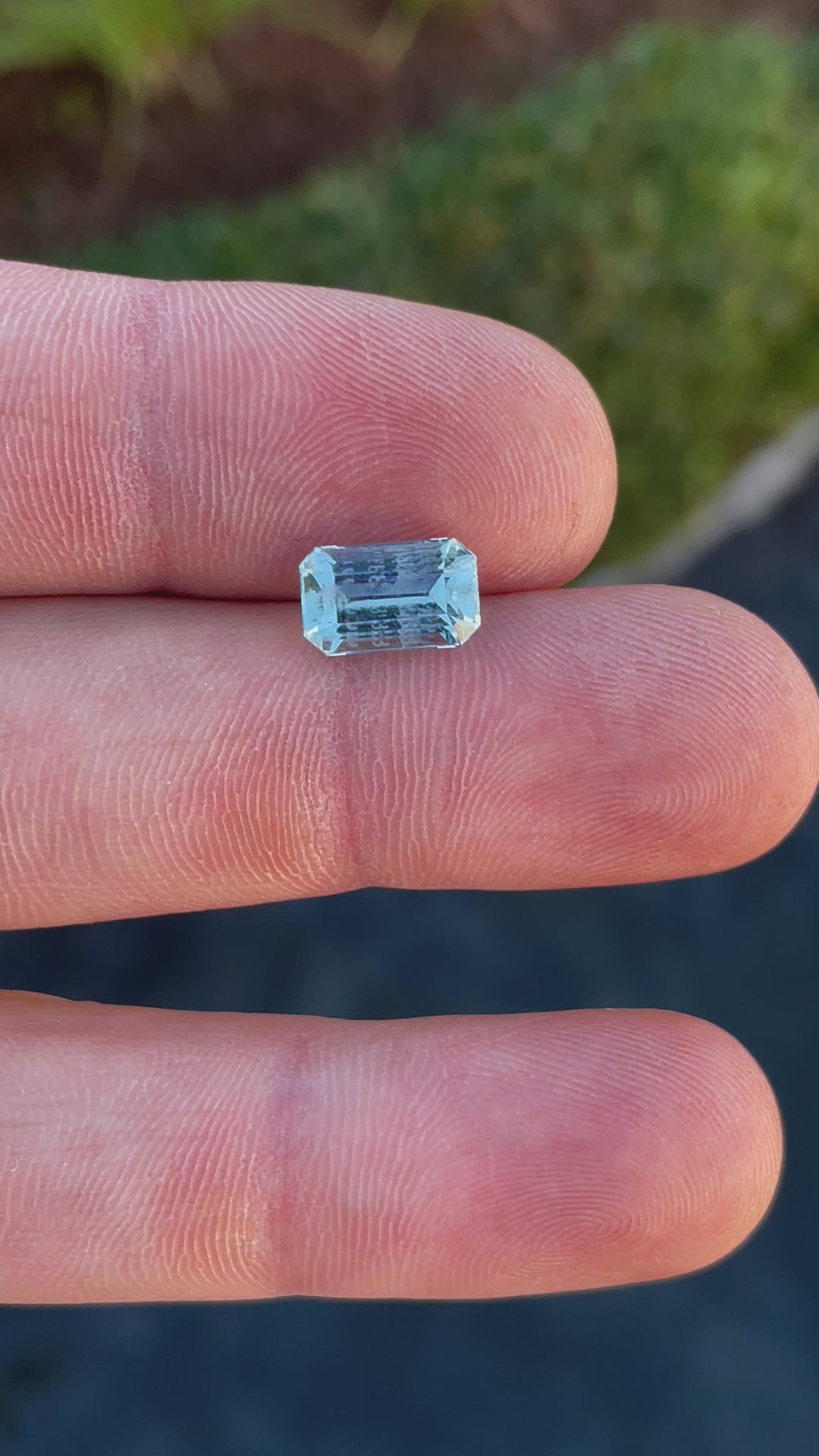 Video showcasing the sparkle and clarity of a 2.78-carat mint blue aquamarine gemstone with emerald cut facets.