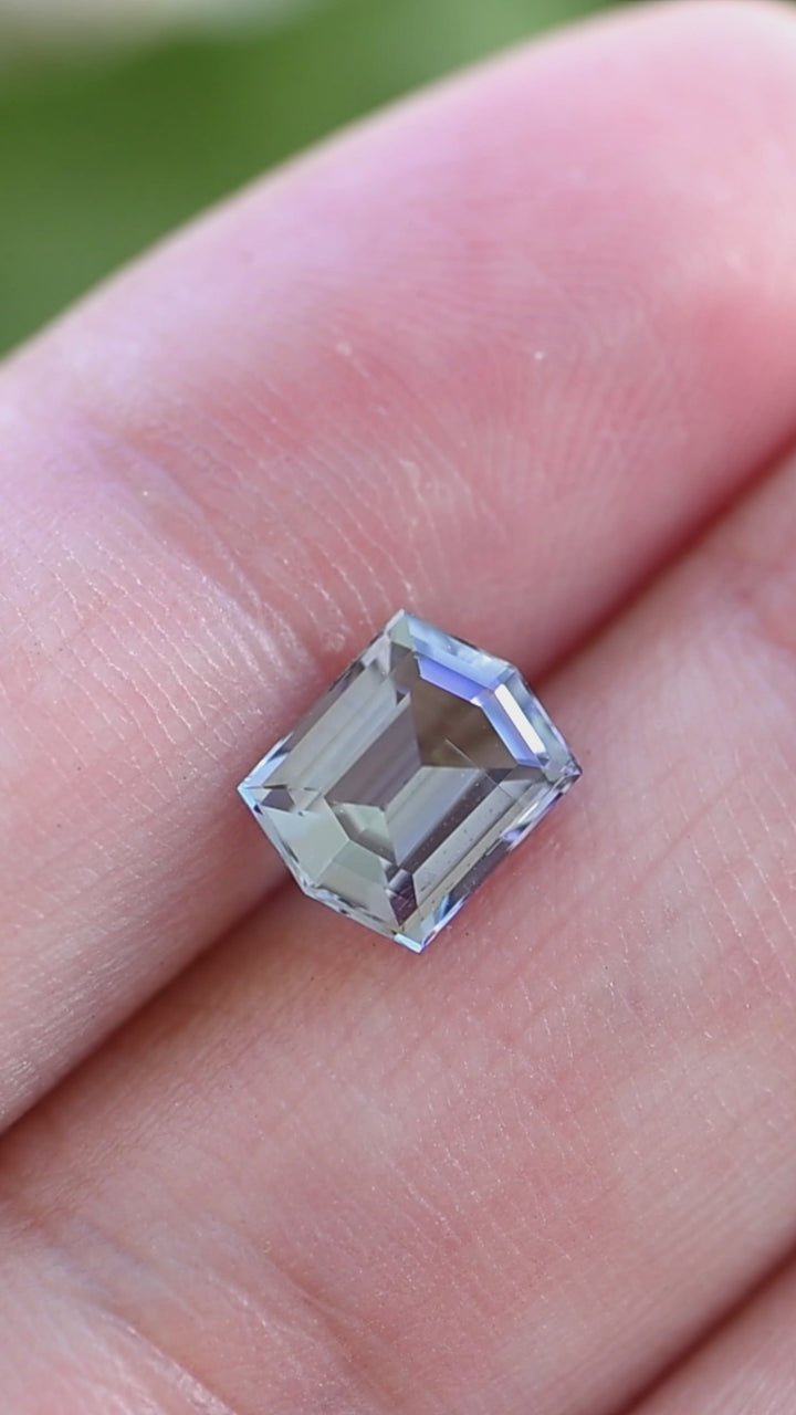 Experience the refined pleochroism of this natural untreated Merelani tanzanite as its custom hexagonal step cut showcases graceful blue, green, and violet color changes from every angle.