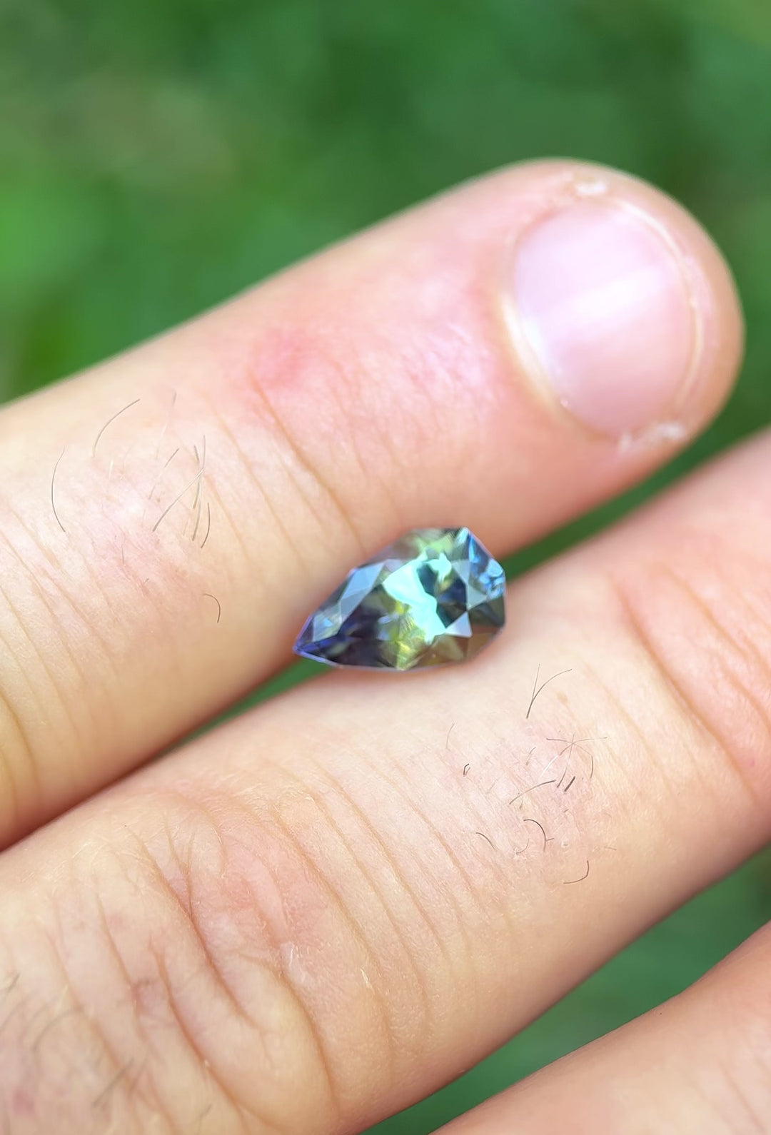 360° video of 2.46ct untreated Tanzanite in custom geometric pear shape showcasing shifting mermaid, green, and yellow hues – natural Tanzanian origin
