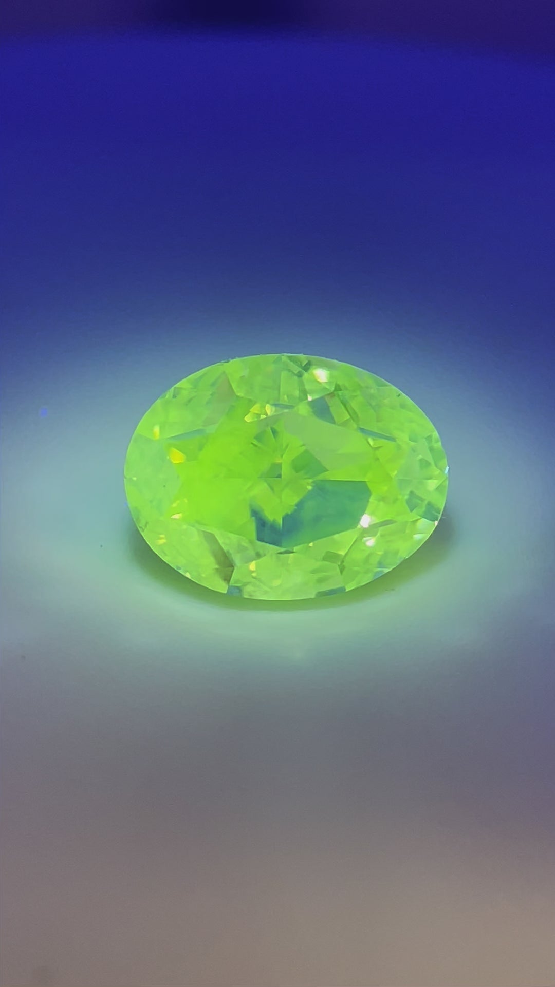 A view of the 2.71-carat oval modified brilliant diamond, showing its size, clarity, and beautiful color fluorescence.