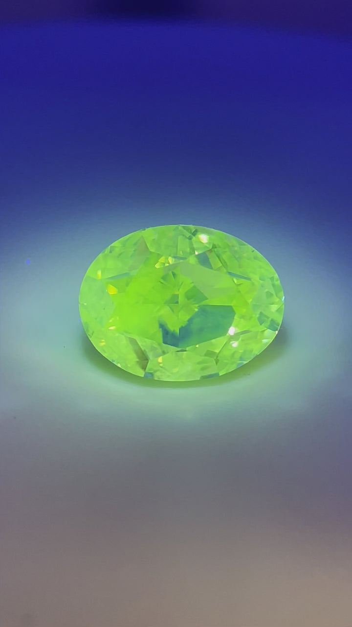 A view of the 2.71-carat oval modified brilliant diamond, showing its size, clarity, and beautiful color fluorescence.