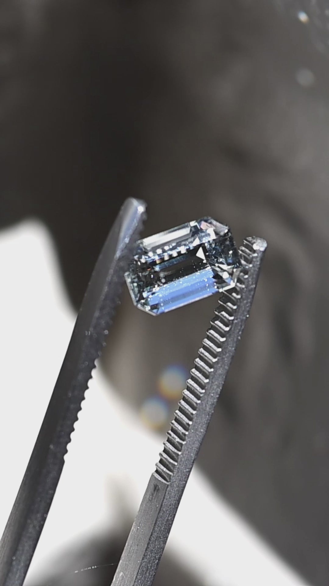 Watch this untreated 1.63 carat Colorado aquamarine in natural daylight as its custom emerald cut reveals exceptional transparency, soft pale blue color, and elegant step-cut reflections.