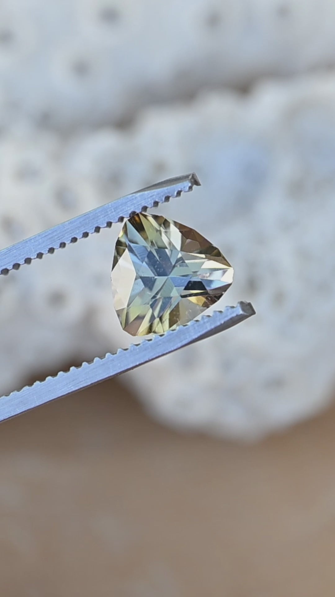 Watch this untreated 1.81 carat Merelani Hills tanzanite display remarkable shifts between teal, green and golden yellow through its precision custom brilliant trillion cut.