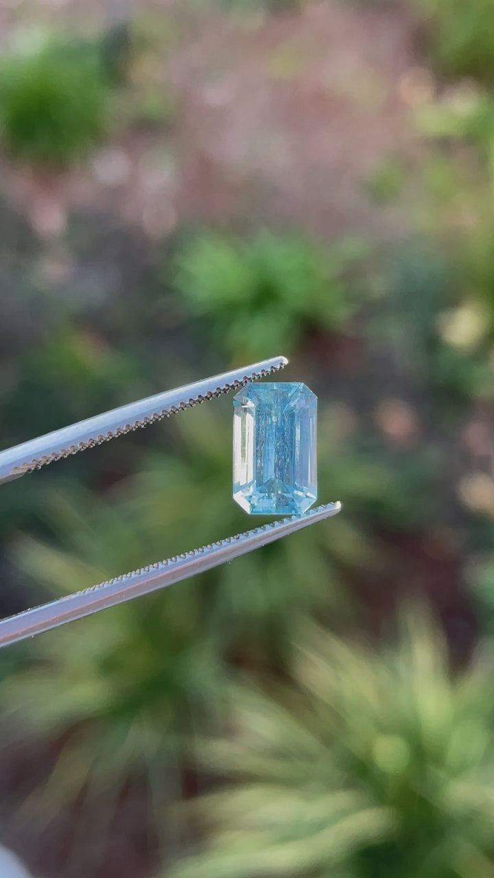 Close-up of a 1.84-carat seafoam blue emerald-cut aquamarine gemstone from Mount Antero, Colorado, showcasing its pristine clarity and natural untreated beauty.