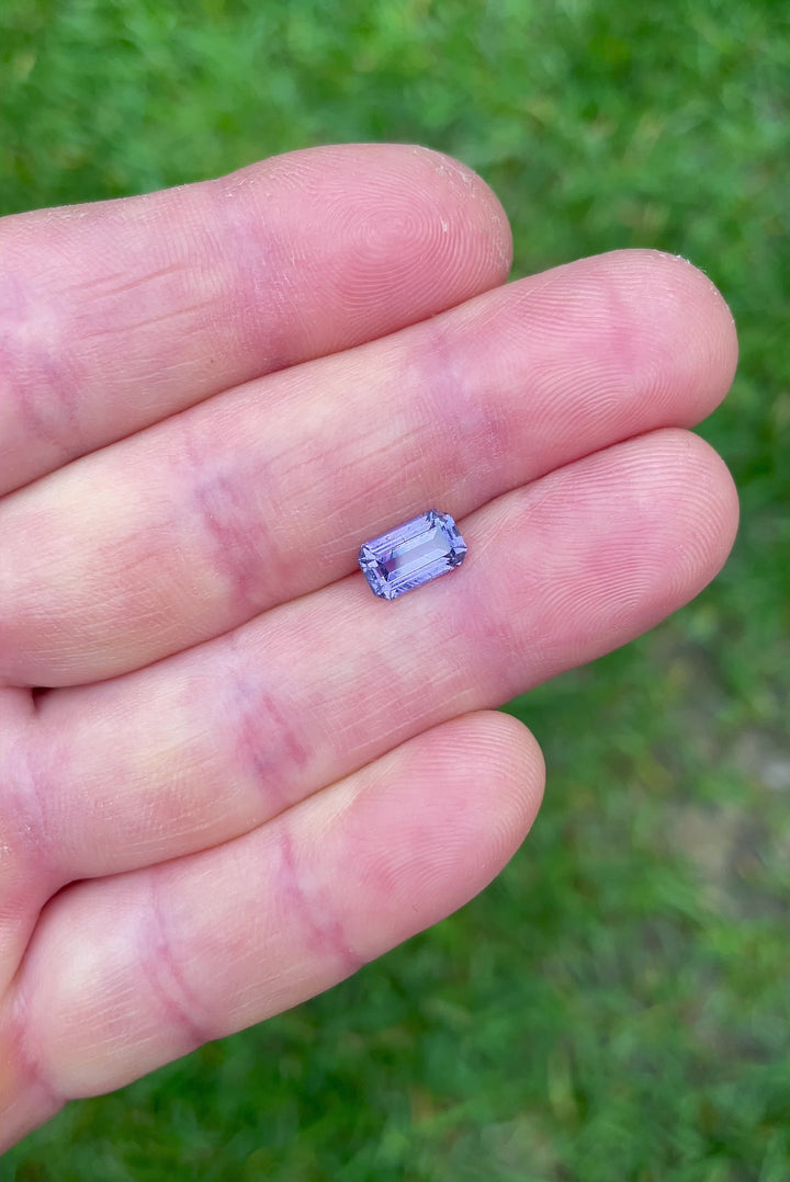 360-degree lighting video of natural violet sapphire, 1.74ct, highlighting precision antique-style emerald faceting