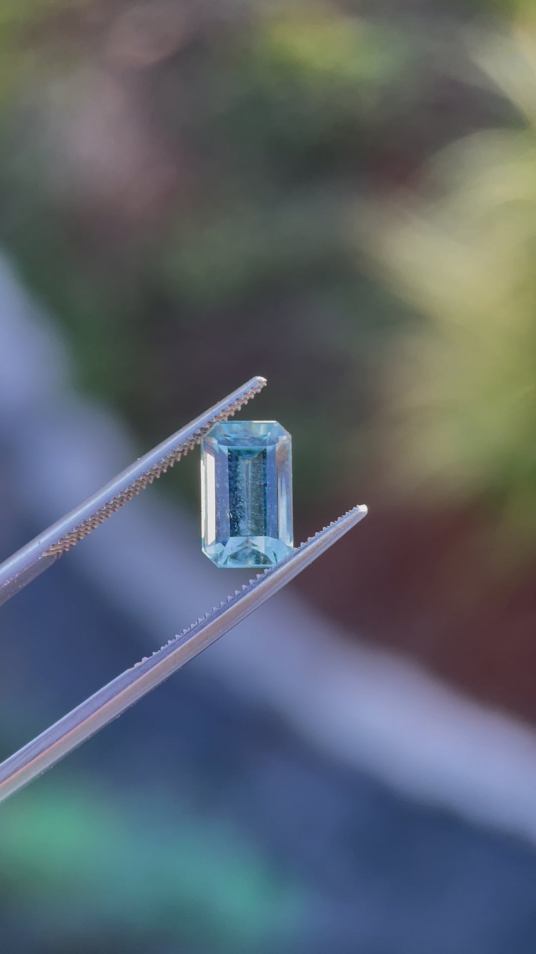 360-degree view of a 2.78-carat mint blue emerald cut aquamarine gemstone highlighting its brilliance and facets.