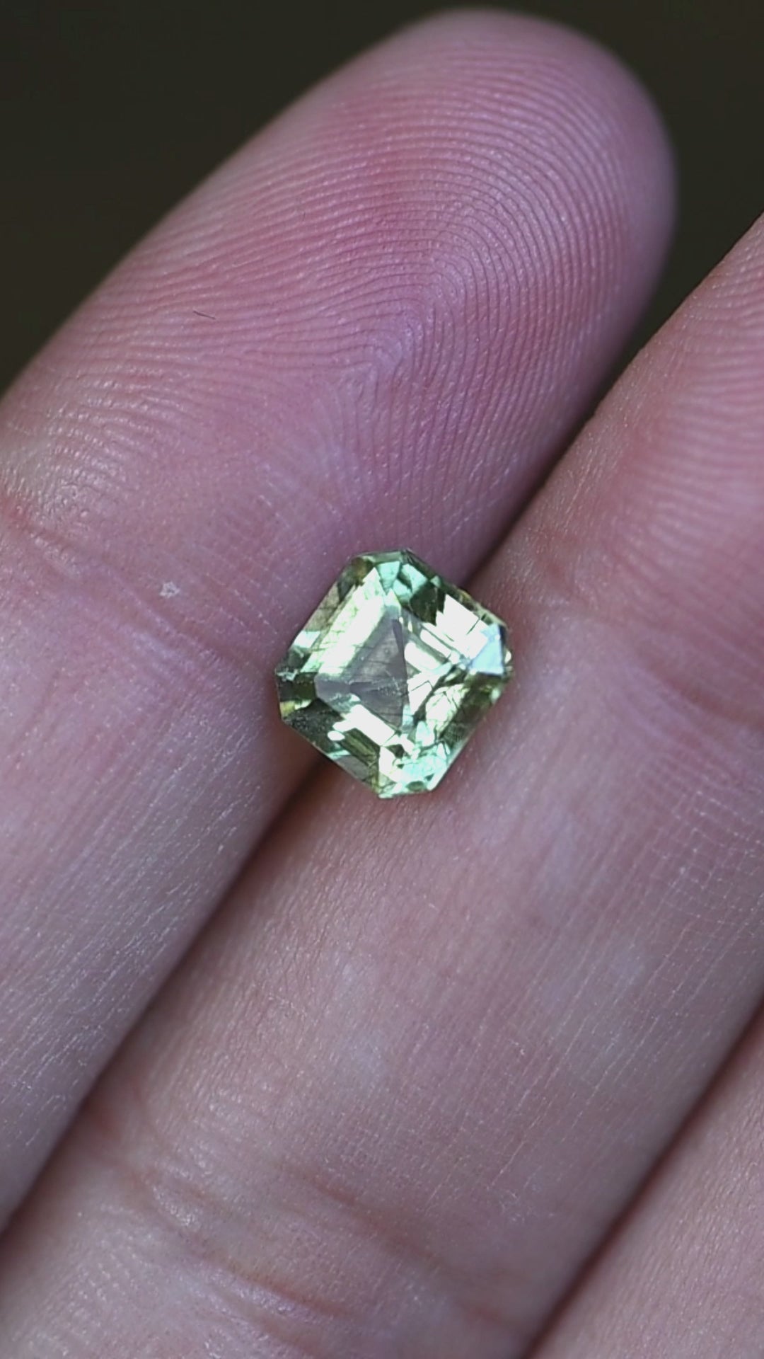 Watch this untreated 1.72 carat Pakistani peridot in natural light as its custom Asscher cut reveals crisp reflections, vivid lime-green color, and unique natural inclusions.