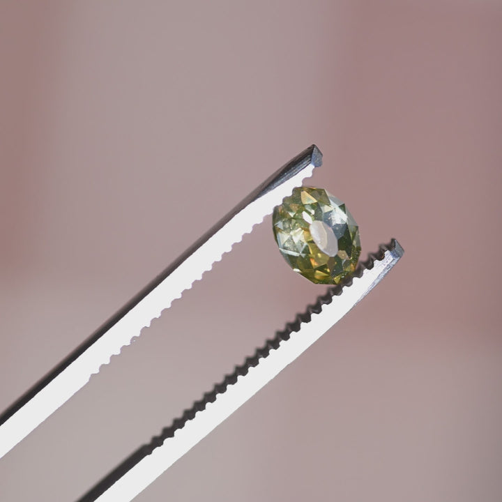 Rotating loose 1.12 carat fancy yellow brown Mughal cut diamond from South Africa showing its warm champagne body color and shifting reflections.