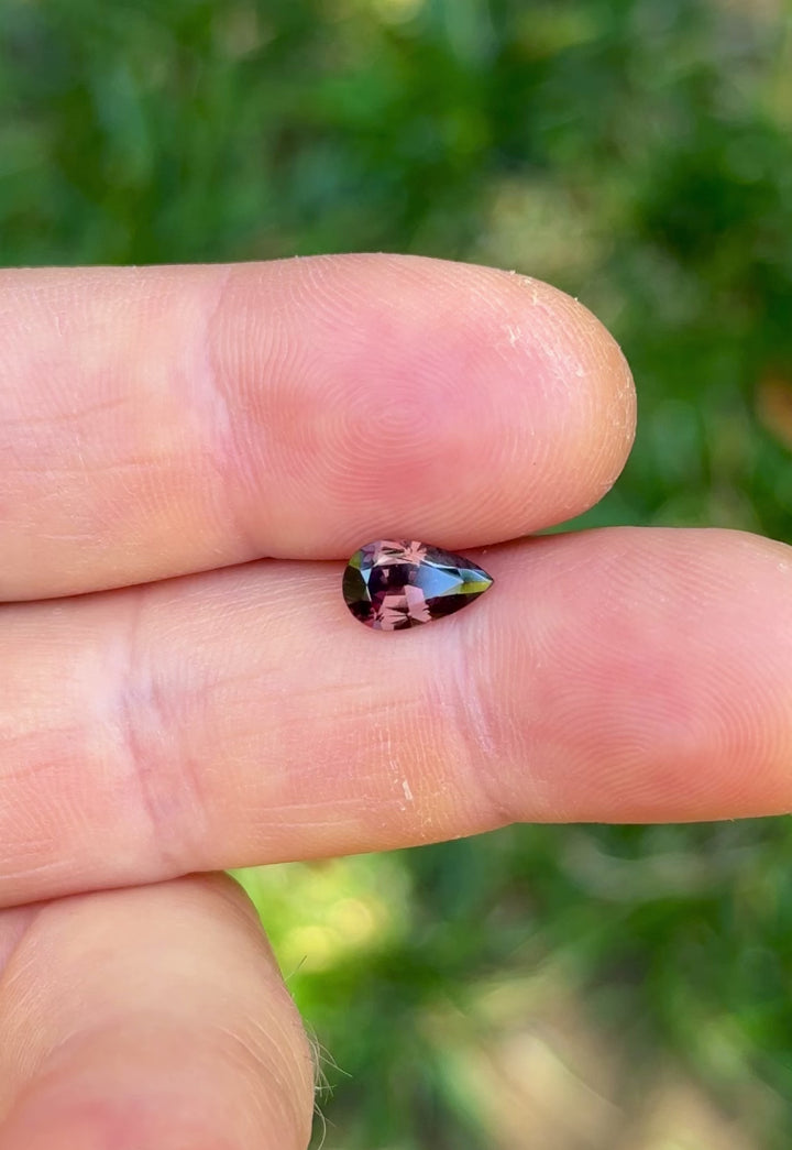 Macro video of ethically sourced pear cut sapphire from Tanzania with dramatic color shift and brilliant sparkle