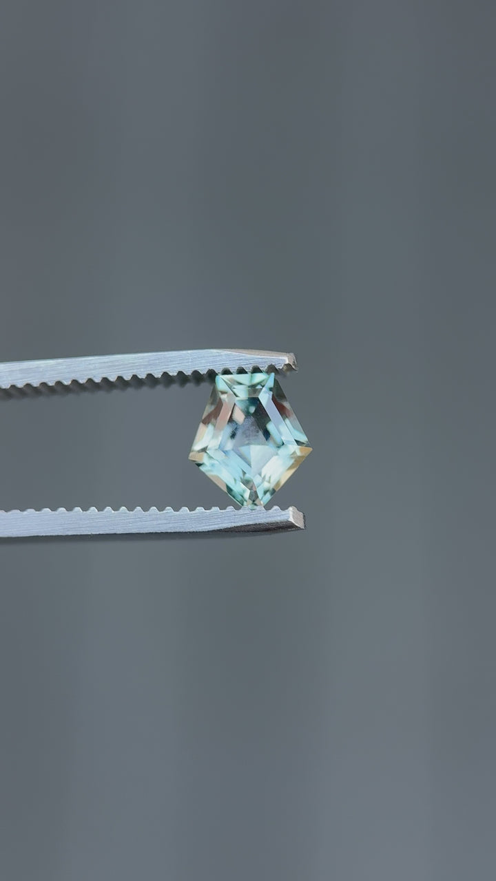 High-resolution video of heated Montana sapphire showcasing color change from teal blue to grey purple