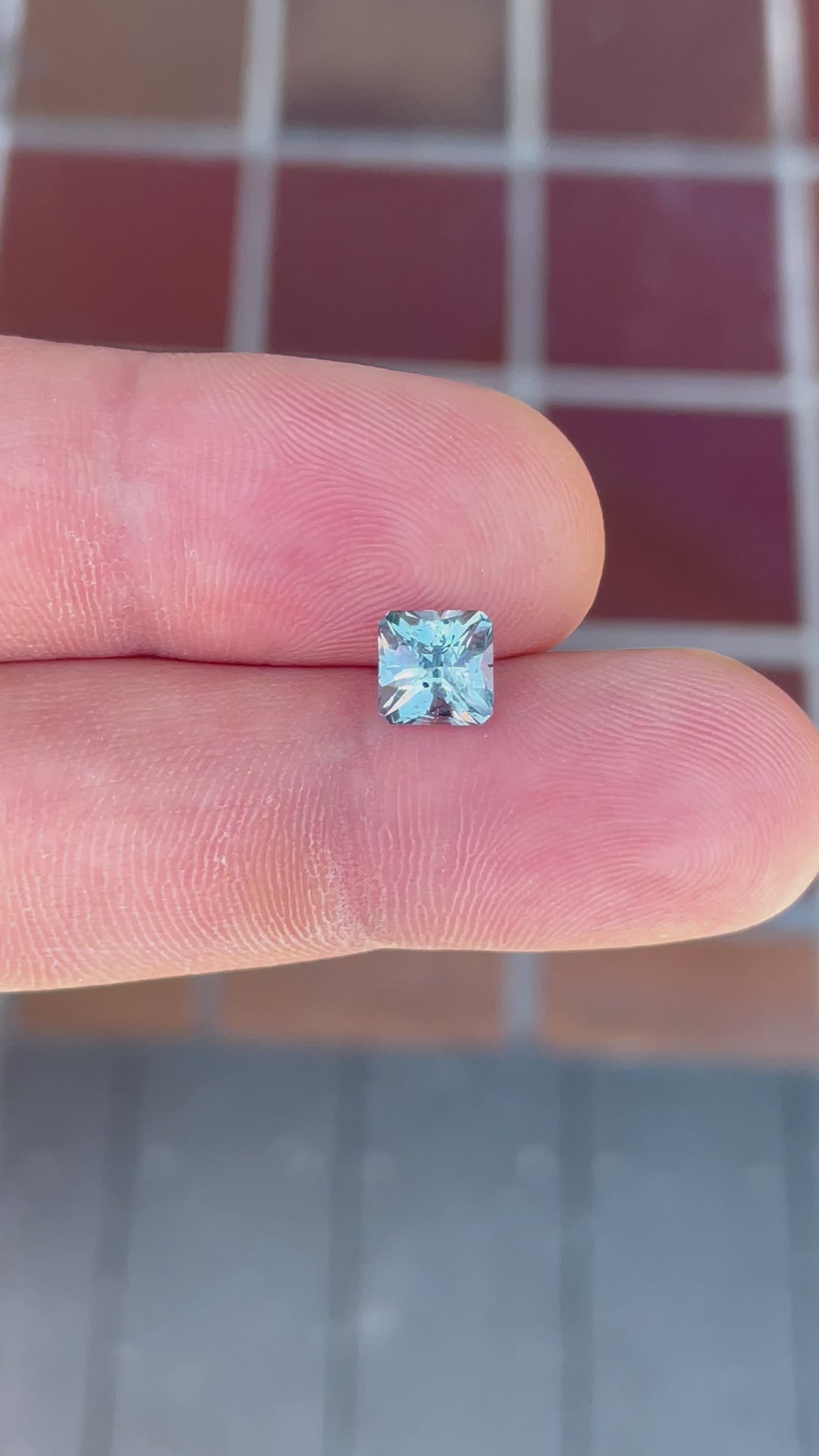 Close-up video of a 2.49-carat Sapphire, highlighting its brilliant teal and blue colors and cushion cut. Sourced from El Dorado Bar Deposit in Montana, USA.