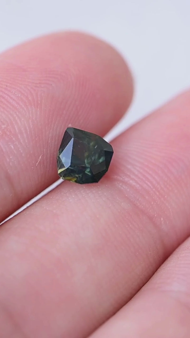 View the scale, deep teal color and distinctive angular pear shape of this untreated 1.26ct sapphire from the Central Queensland Gemfields, Australia. Its broad facets reveal contrasting blue-green tones and natural internal character.