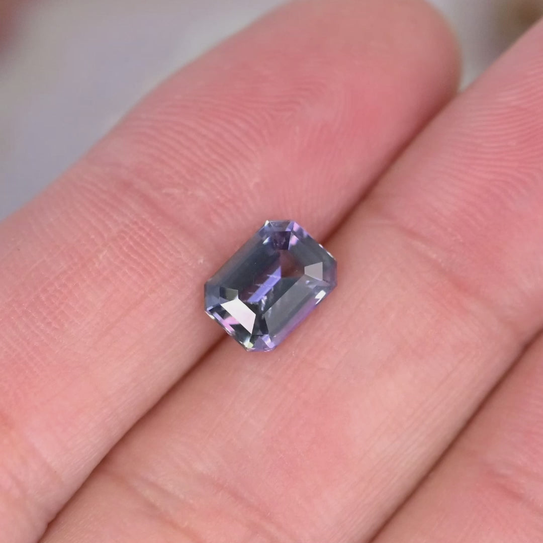 Close up video of 1.76ct blue purple Tanzanite displaying step cut sparkle faceting detail and unheated clarity from Merelani Hills