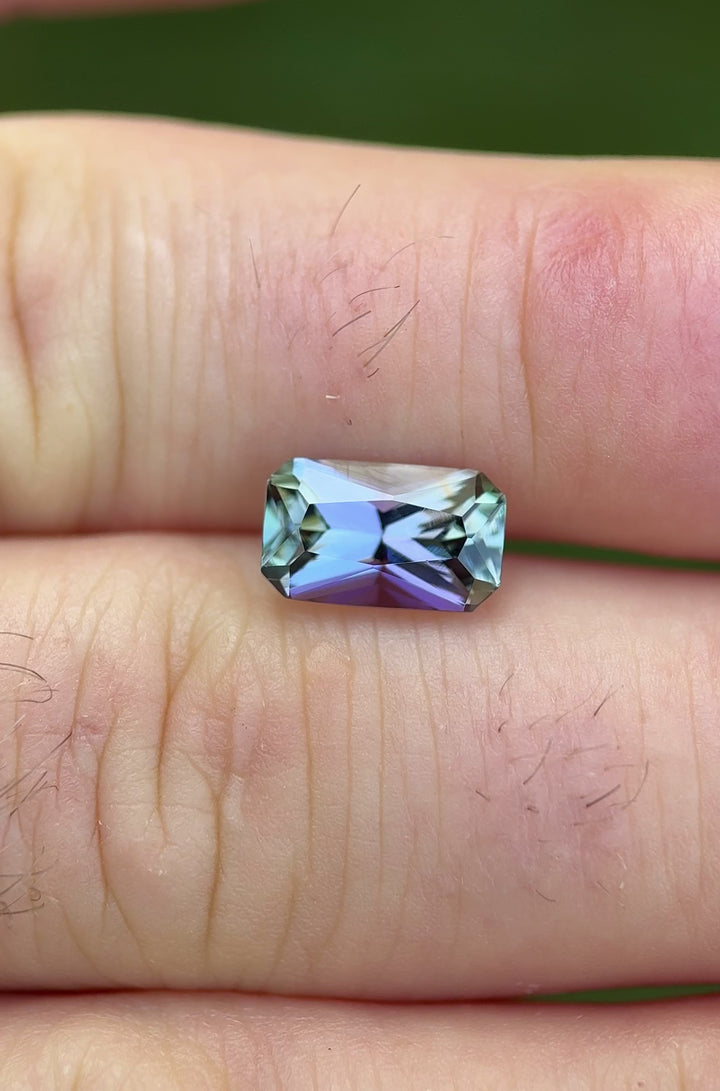 360-degree view of 3.01 carat Tanzanite with natural light reflecting shades of purple, blue, and green