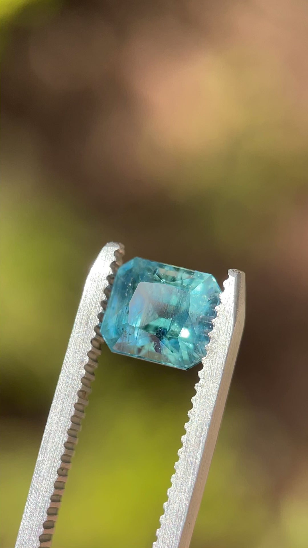 Detailed video of a 2.50-carat Asscher cut sapphire with teal, blue, and green tones from the El Dorado Bar Deposit in Montana.