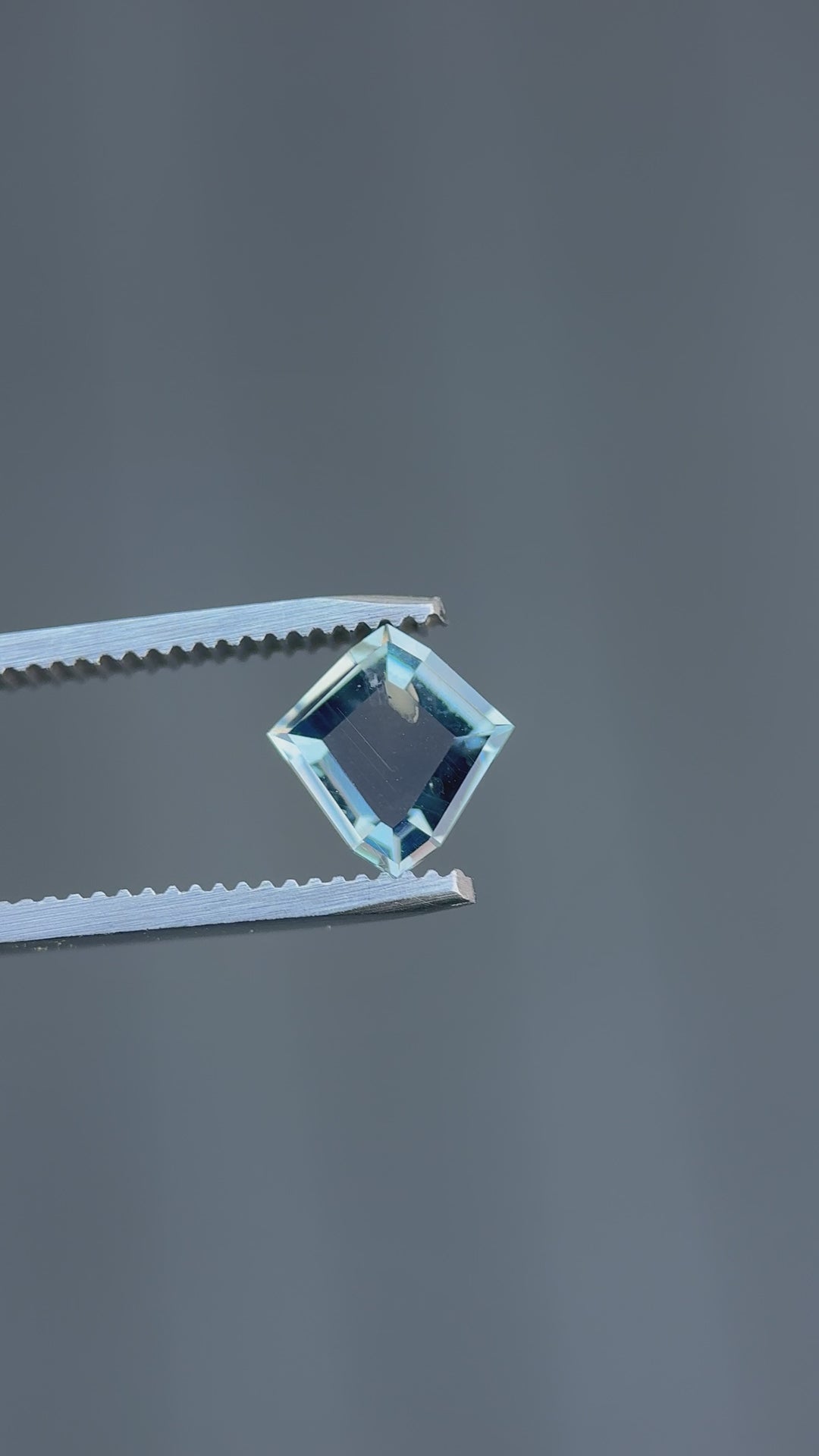 Video of Montana color change sapphire rotating to display transition from blue and lavender to vivid pink under different light sources.