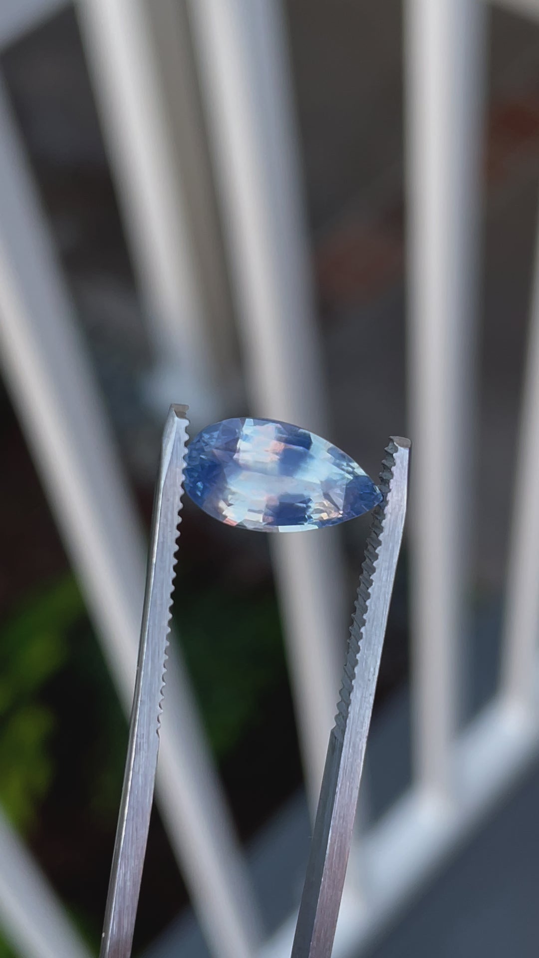 A 360-degree view of a 3.53-carat opalescent blue sapphire with a mix brilliant pear cut, showcasing its mesmerizing sparkle and opalescent blue hue, ethically sourced from Sri Lanka.