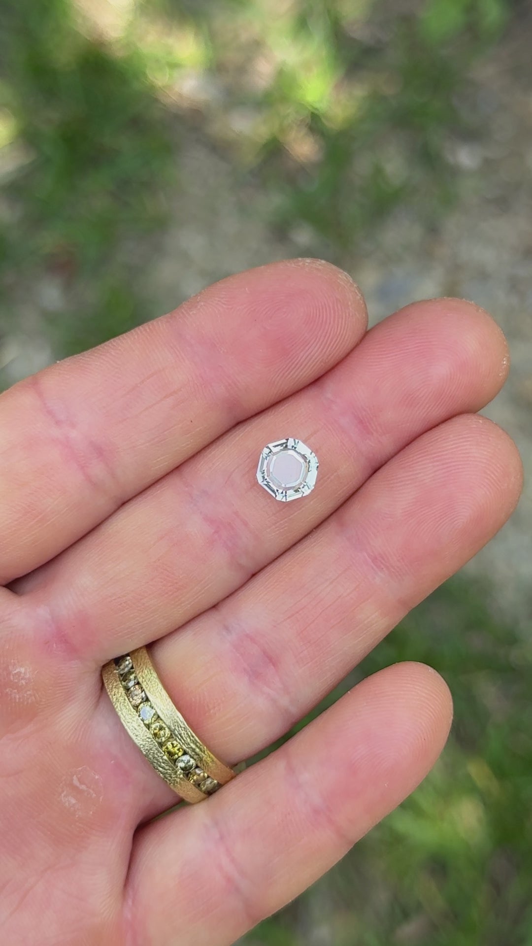 Natural lighting video of 2.09 carat Montana sapphire, showing sparkle and teal color play.