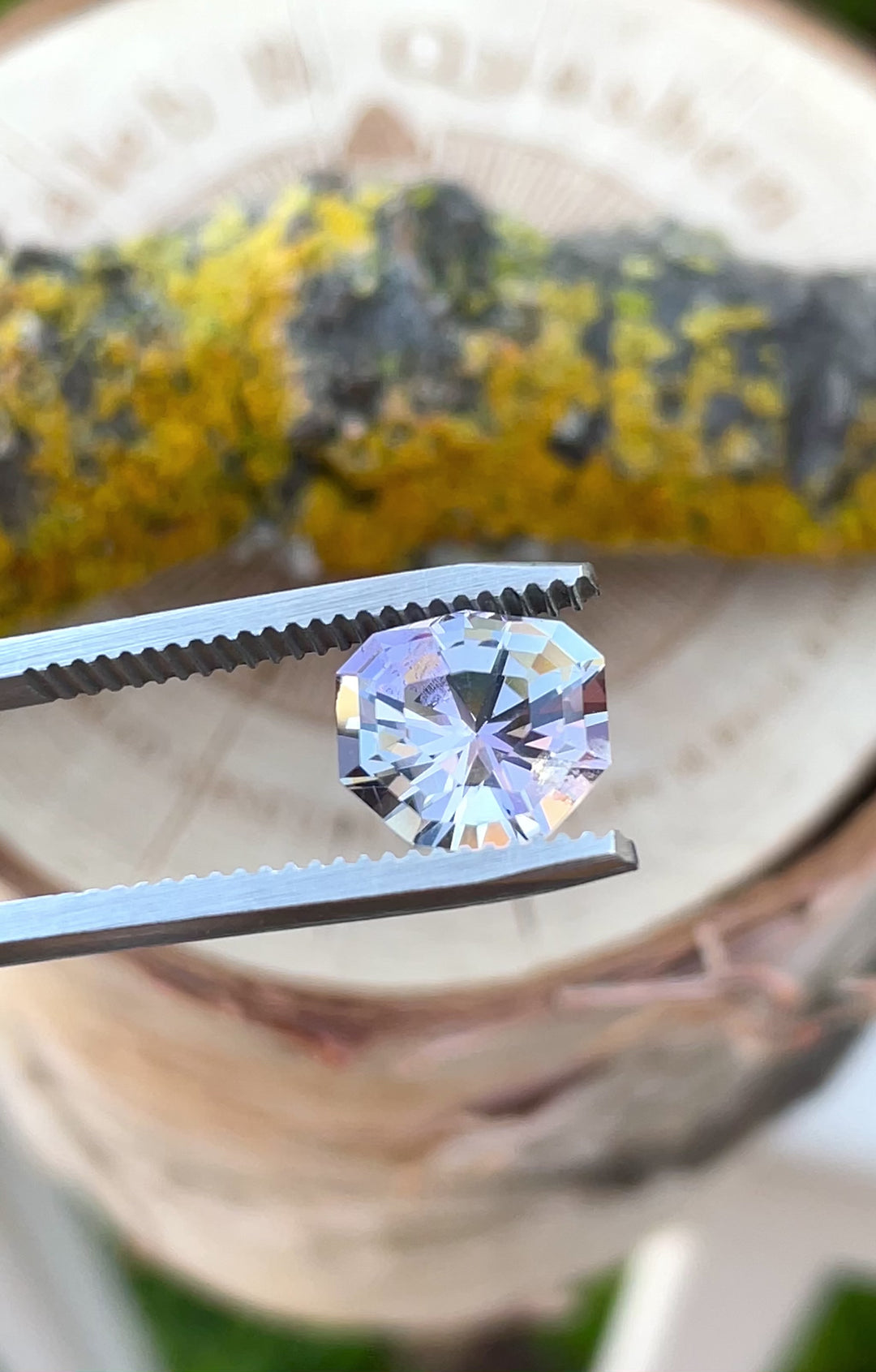 Handheld video revealing the intricate step cut and glowing color mix of a 3.33-carat Tanzanite from Merelani Hills, featuring mermaid, gray, and pastel tones
