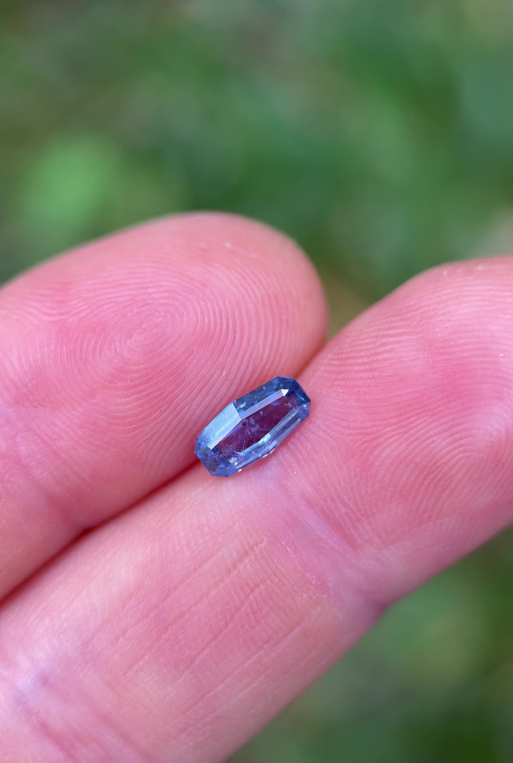 Natural light video of unheated 1.05ct sapphire from Tanzania – elongated cushion shape, vivid cornflower blue tones and step cut brilliance