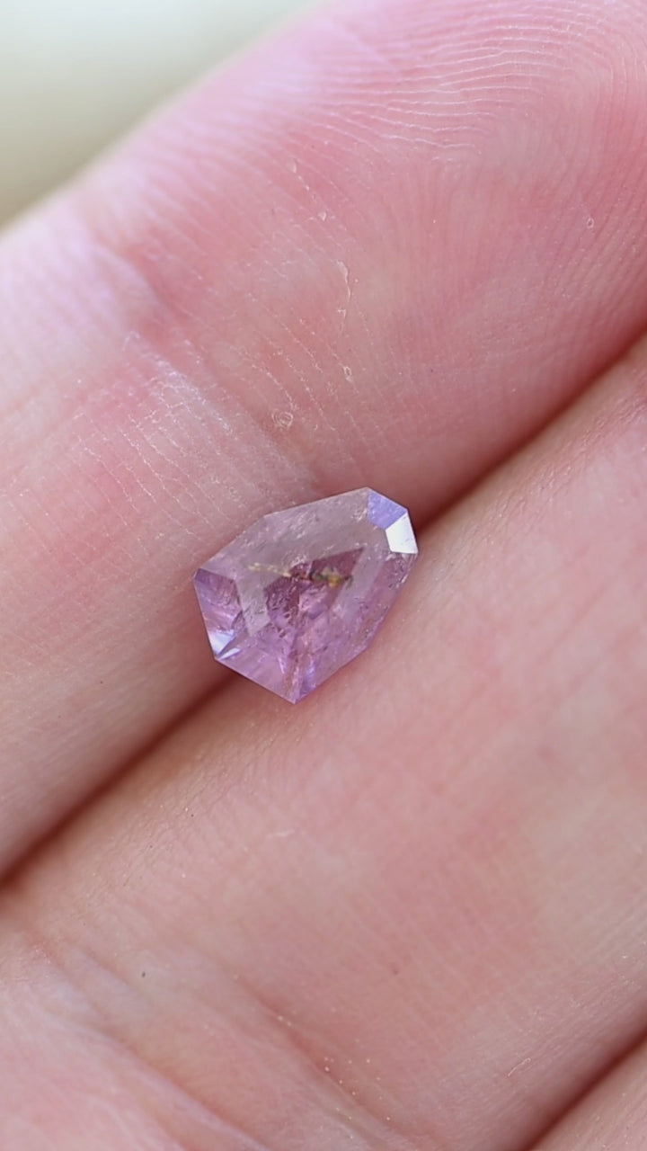 View this natural untreated 1.01 carat rose pink sapphire in hand to appreciate its custom shield mix cut, elegant proportions, and one-of-a-kind internal crystal character.