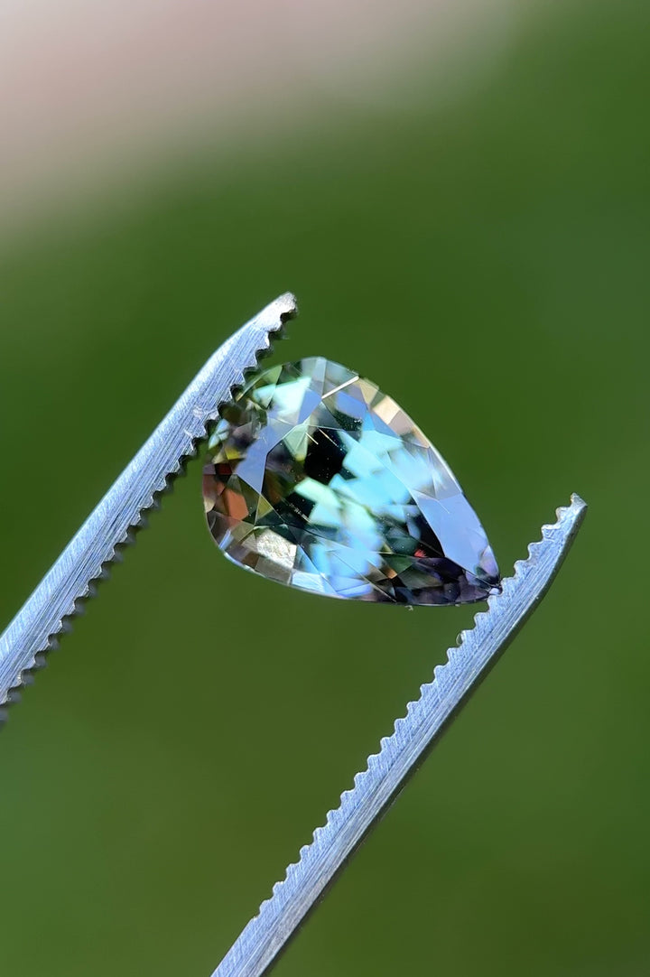 360-degree macro video of untreated Tanzanite from Tanzania, highlighting color shift from teal to peach and purple