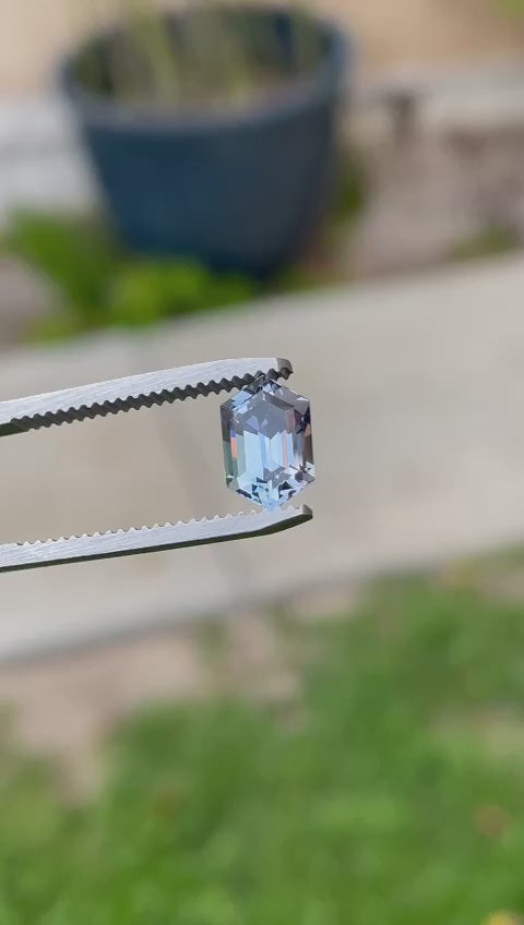 Video showcasing a 1.79 carat hexagon step cut Tanzanite in mesmerizing teal, purple, and blue hues, from Merelani Hills, Tanzania, highlighting its unique color shifts and facets.