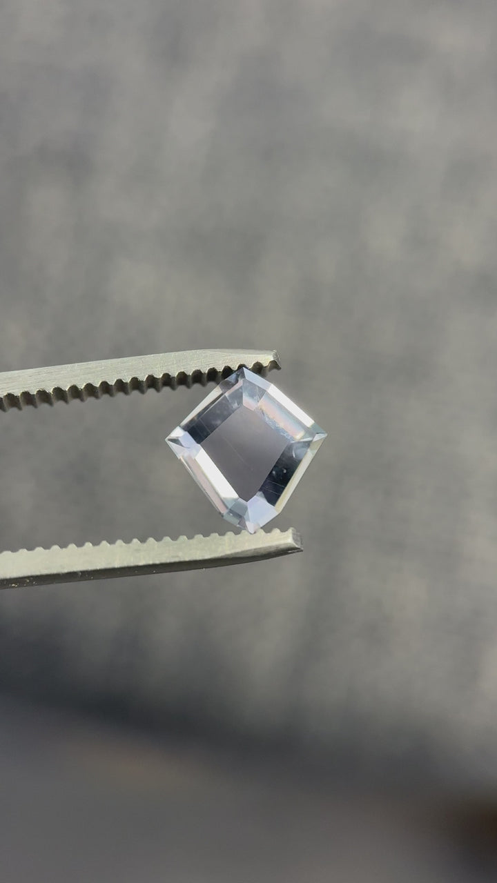 Close-up video of 1.52ct shield portrait cut sapphire showing dramatic color change and precision faceting.
