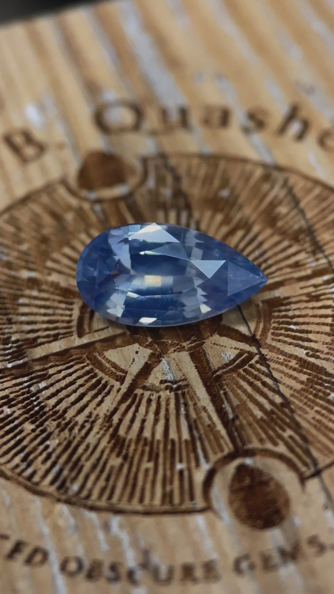 A dynamic video highlighting the brilliance and opalescent glow of a 3.53-carat sapphire with a pear mix brilliant cut, ethically mined from Sri Lanka.