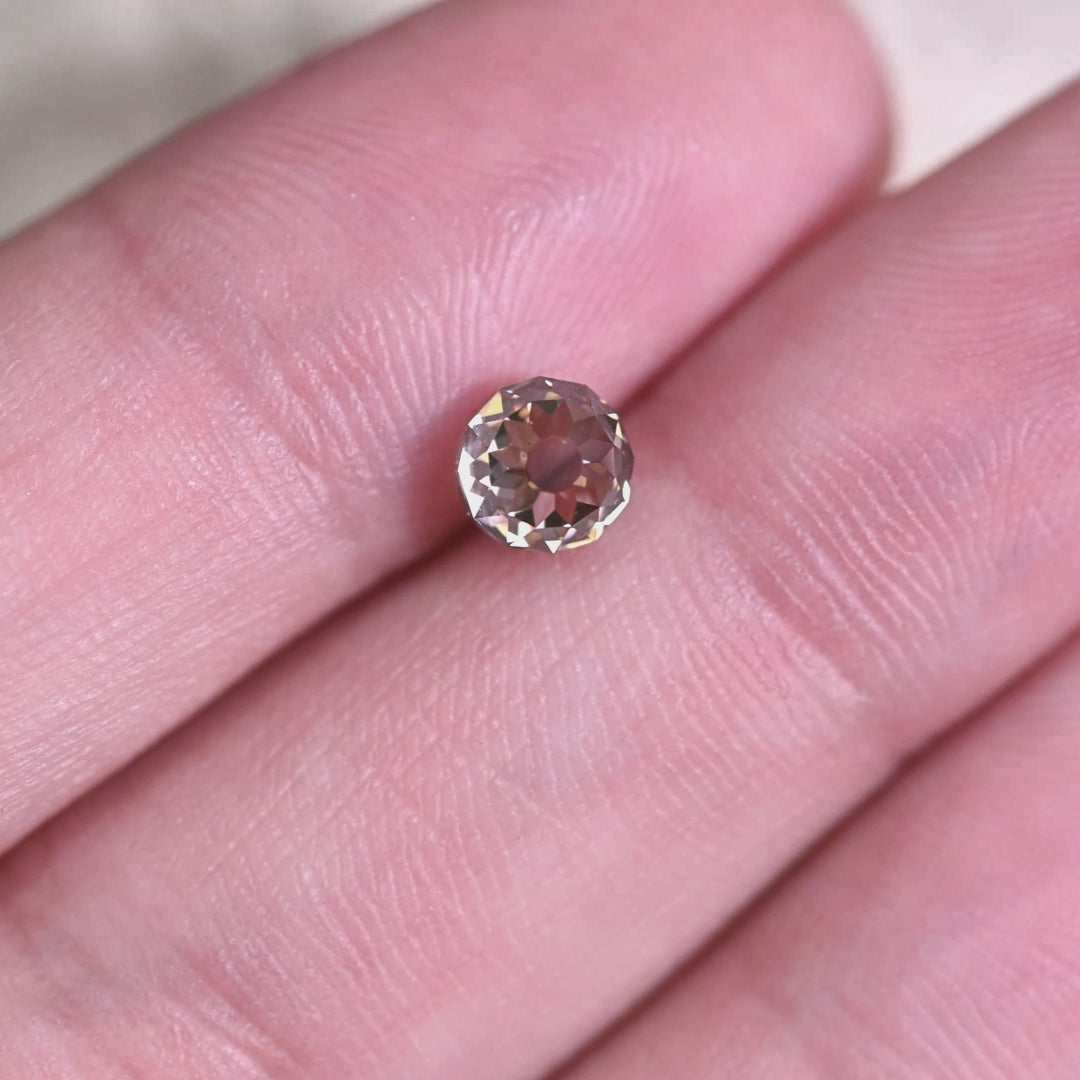 Rotating loose 1.08 carat fancy brown Mughal cut diamond from South Africa showing antique faceting, champagne tone, and strong blue fluorescence reaction.