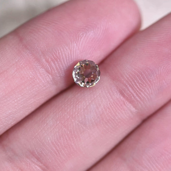 Rotating loose 1.08 carat fancy brown Mughal cut diamond from South Africa showing antique faceting, champagne tone, and strong blue fluorescence reaction.