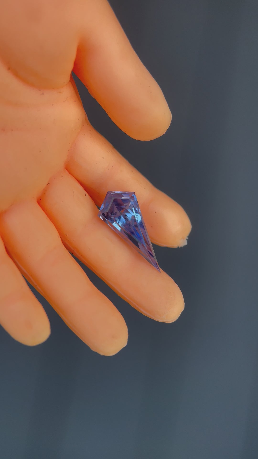 A 360-degree video showcasing the brilliance and intricate facets of a 1.70-carat powder blue kite-shaped sapphire. Ethically sourced and untreated from Sri Lanka.