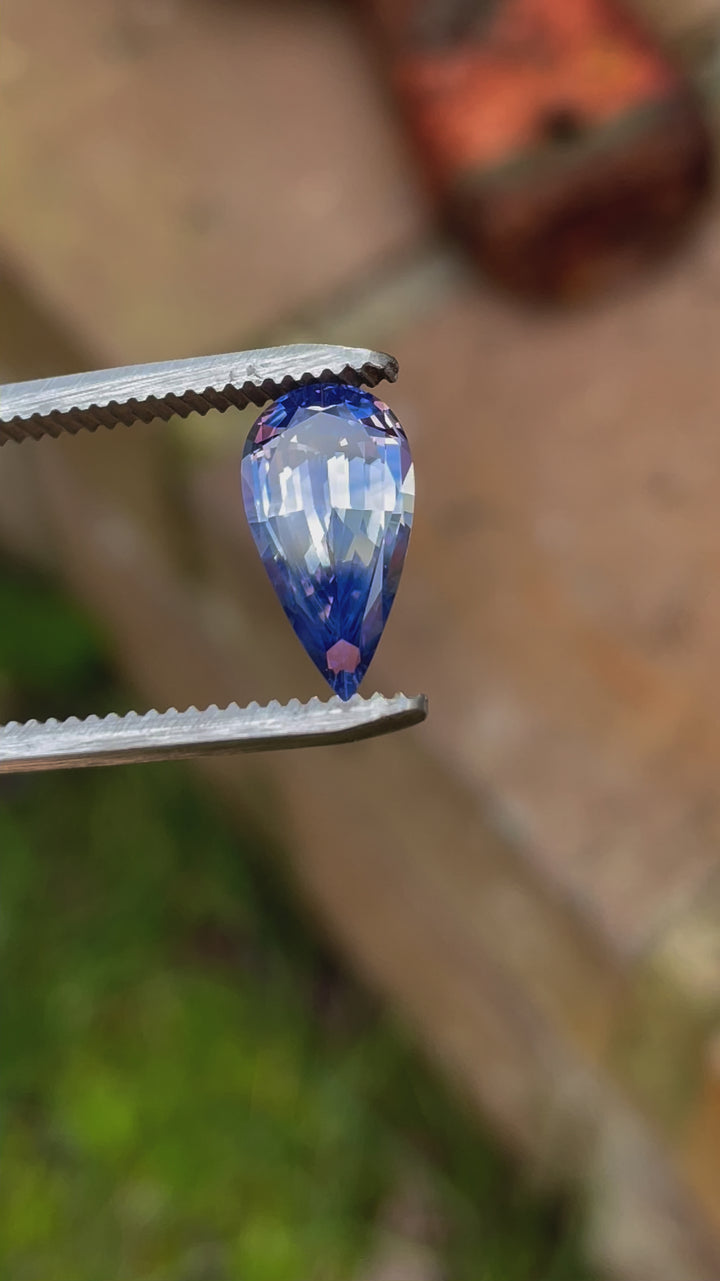 A 360-degree video showcasing the vibrant blue and yellow hues of a 3.14-carat pear-shaped parti sapphire. The untreated gemstone is ethically sourced from Sri Lanka.