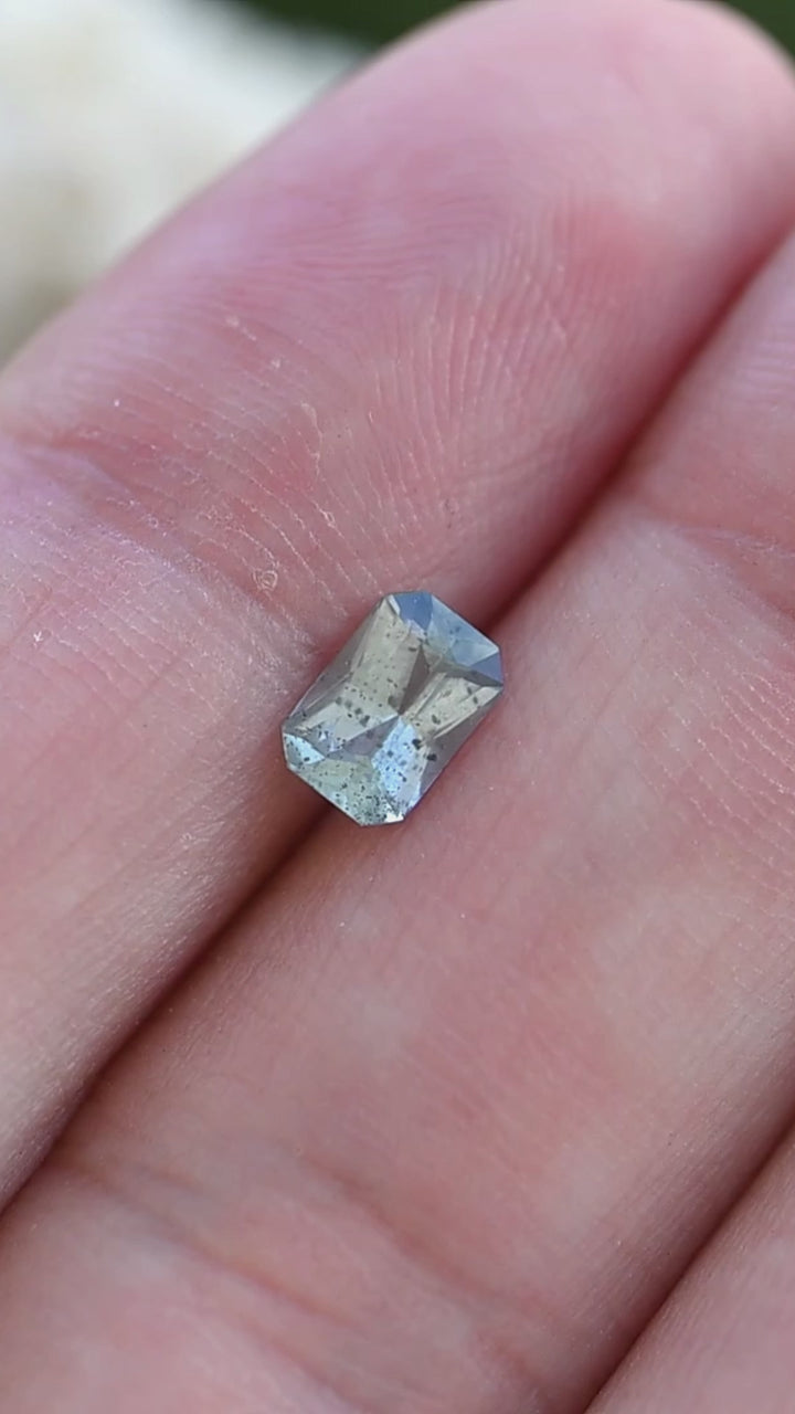 Experience the understated beauty of this untreated Montana sapphire as its precision radiant cut highlights soft smoky aqua tones and unique natural character.